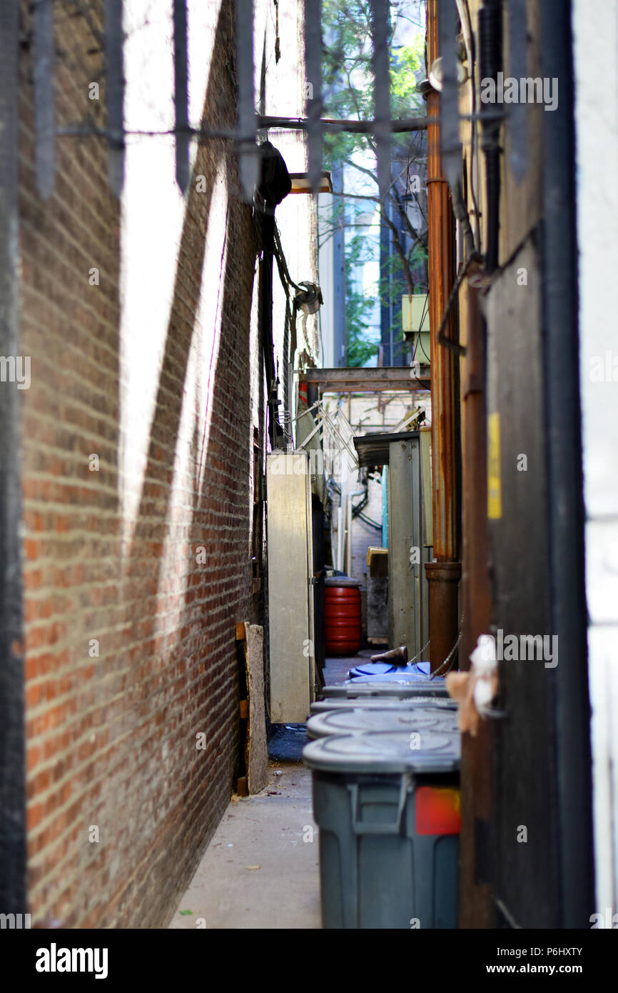 New York alleyway with trash cans between buildings Stock Photo Alamy