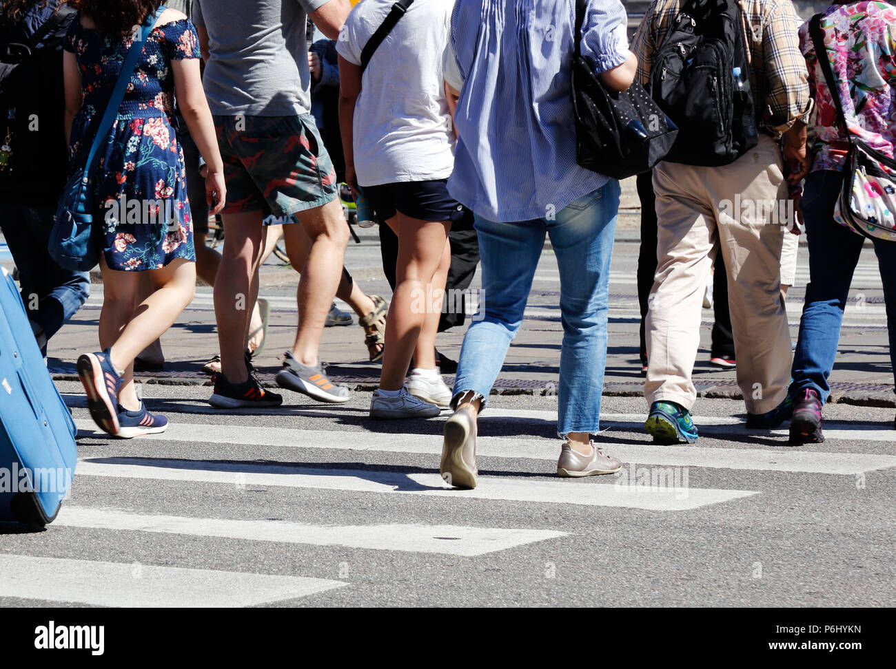 Copenhagen, Denmark - June 27, 2017: People crossing a crosswalk in downtown Copenhagen. Stock Photo