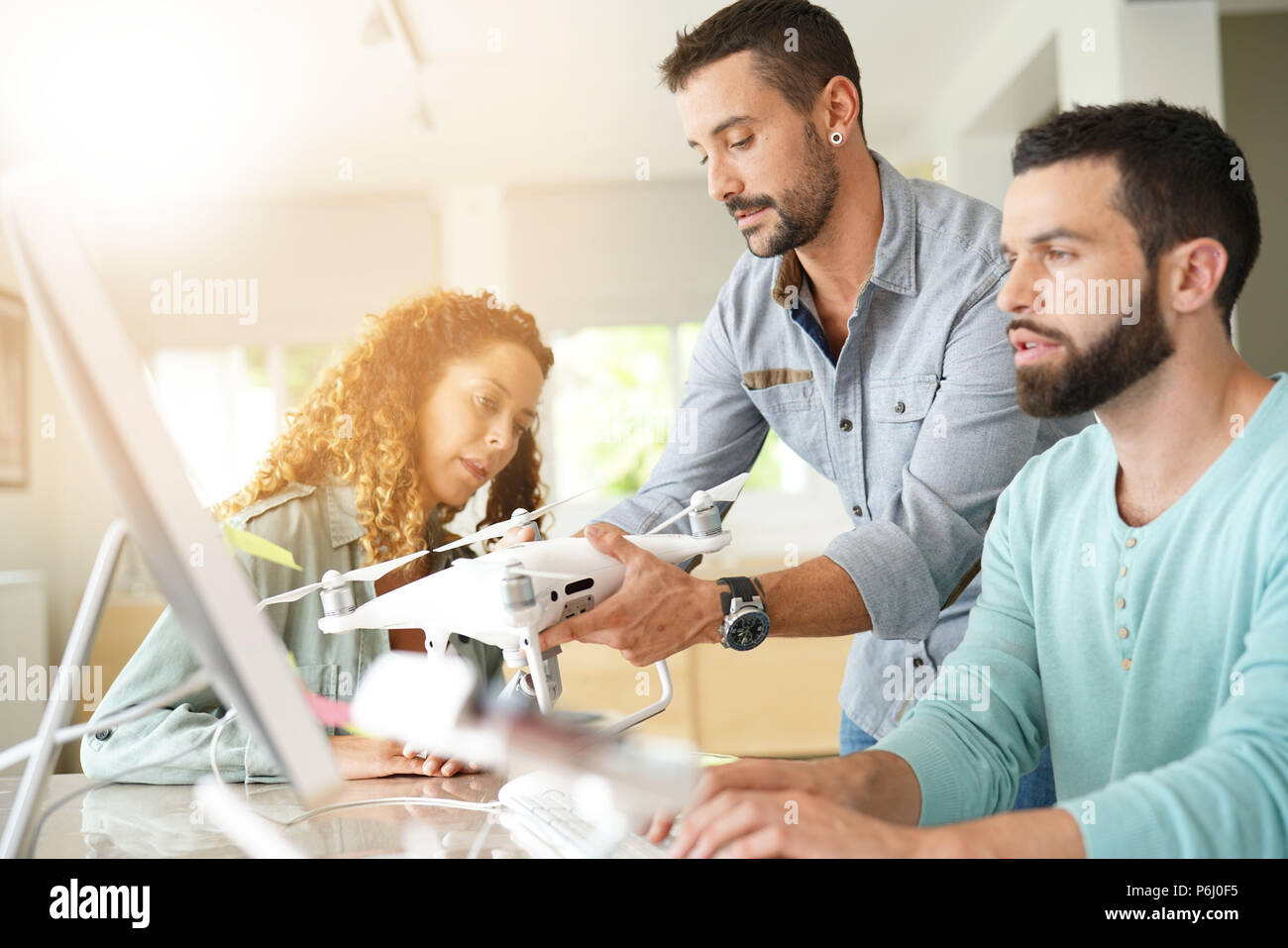 Startup people in office working on drone technology Stock Photo - Alamy