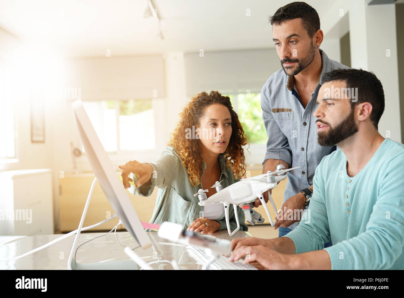 Startup people in office working on drone technology Stock Photo - Alamy