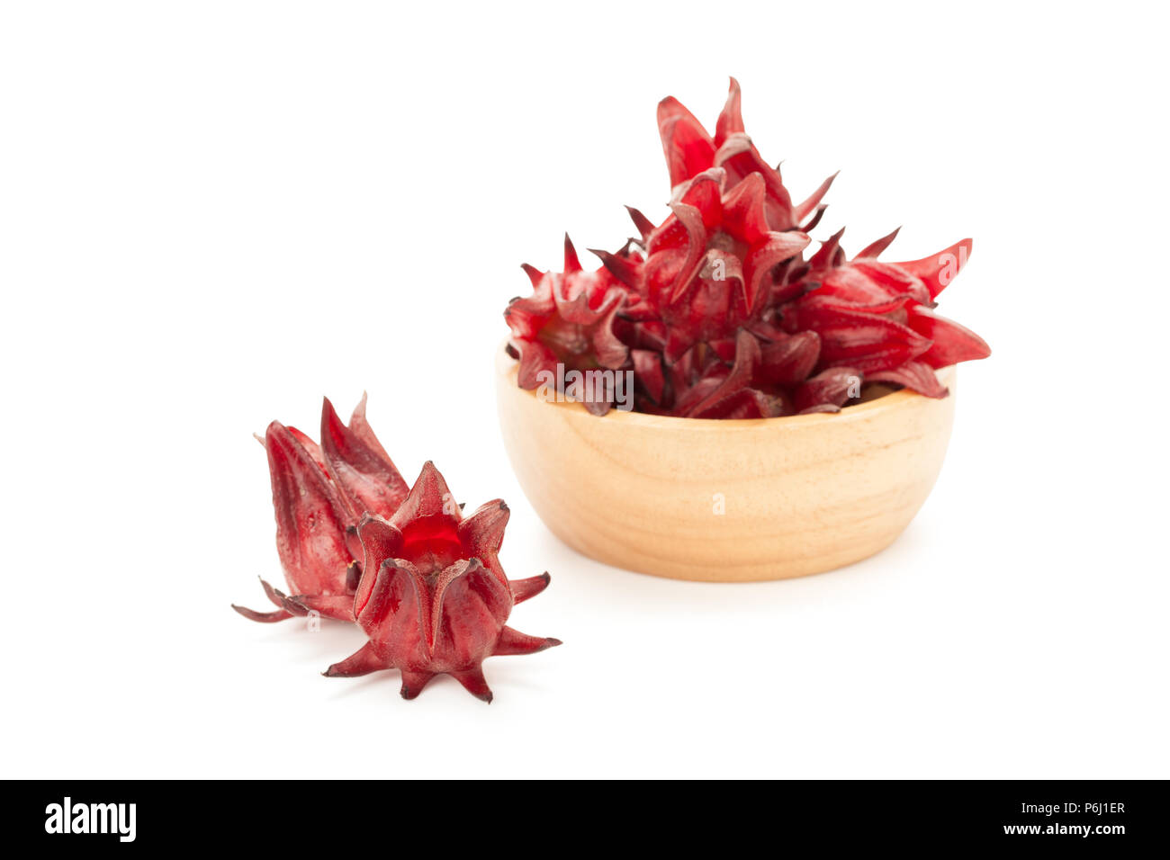 red roselle wooden bowl isolated on white background with clipping path and soft shadow Stock Photo
