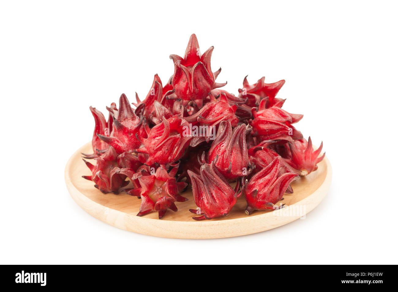 red roselle wooden plate isolated on white background with clupping path and soft shadow Stock Photo