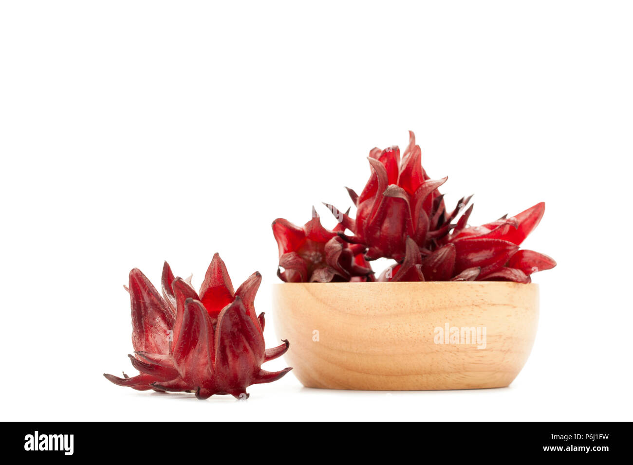 front view angle of red roselle wooden bowl isolated on white background Stock Photo