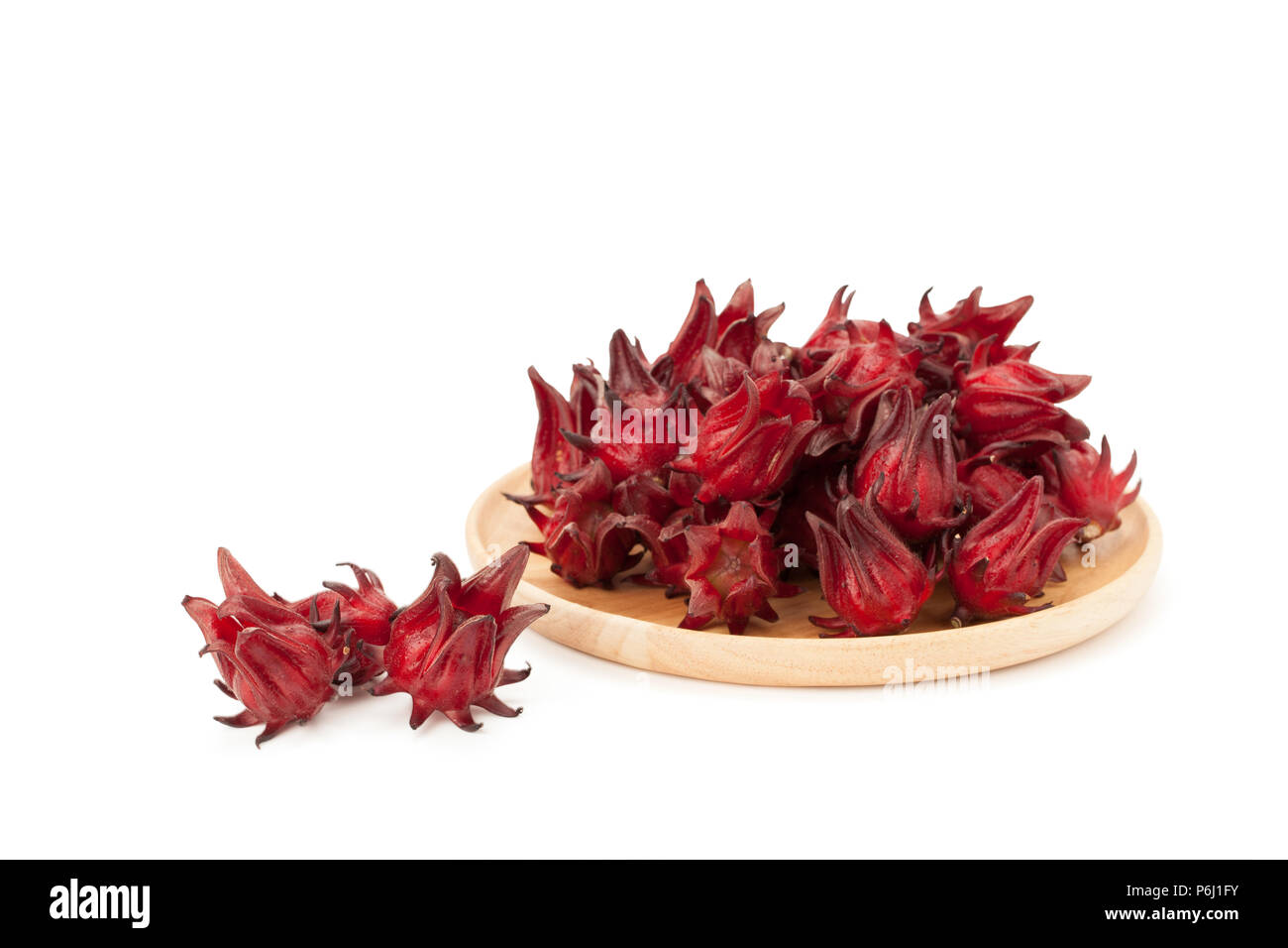 red roselle wooden plate isolated on white background with clipping path and soft shadow Stock Photo