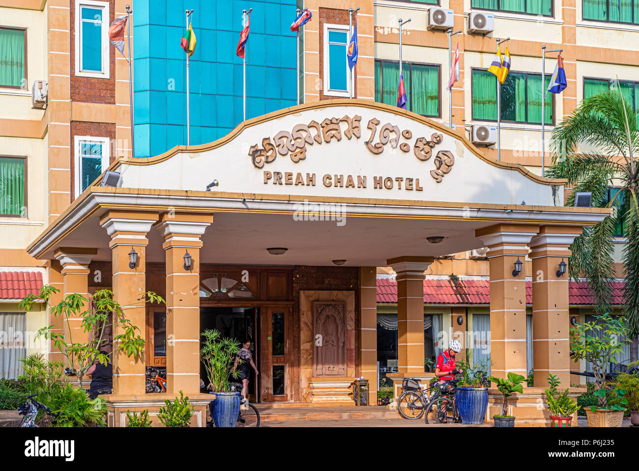 sisophon cambodia november 21 2017 cyclist at the entrance to the preah chan hotel in sisophon cambodia P6J235