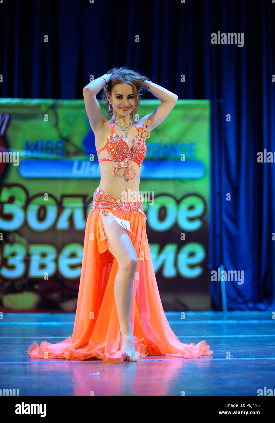 Dancer in a native dresses performing oriental dance on stage. Festival Miss Belly dance 2017. March 7, 2017. Kiev, Ukraine Stock Photo