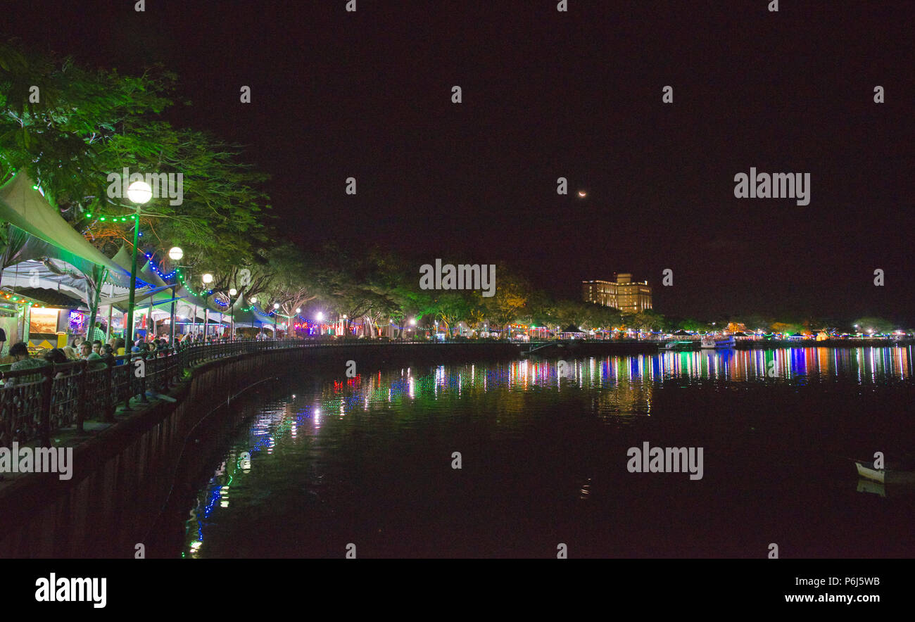 Waterfront restaurants and promenade at night Kuching Sarawak Malaysia Stock Photo