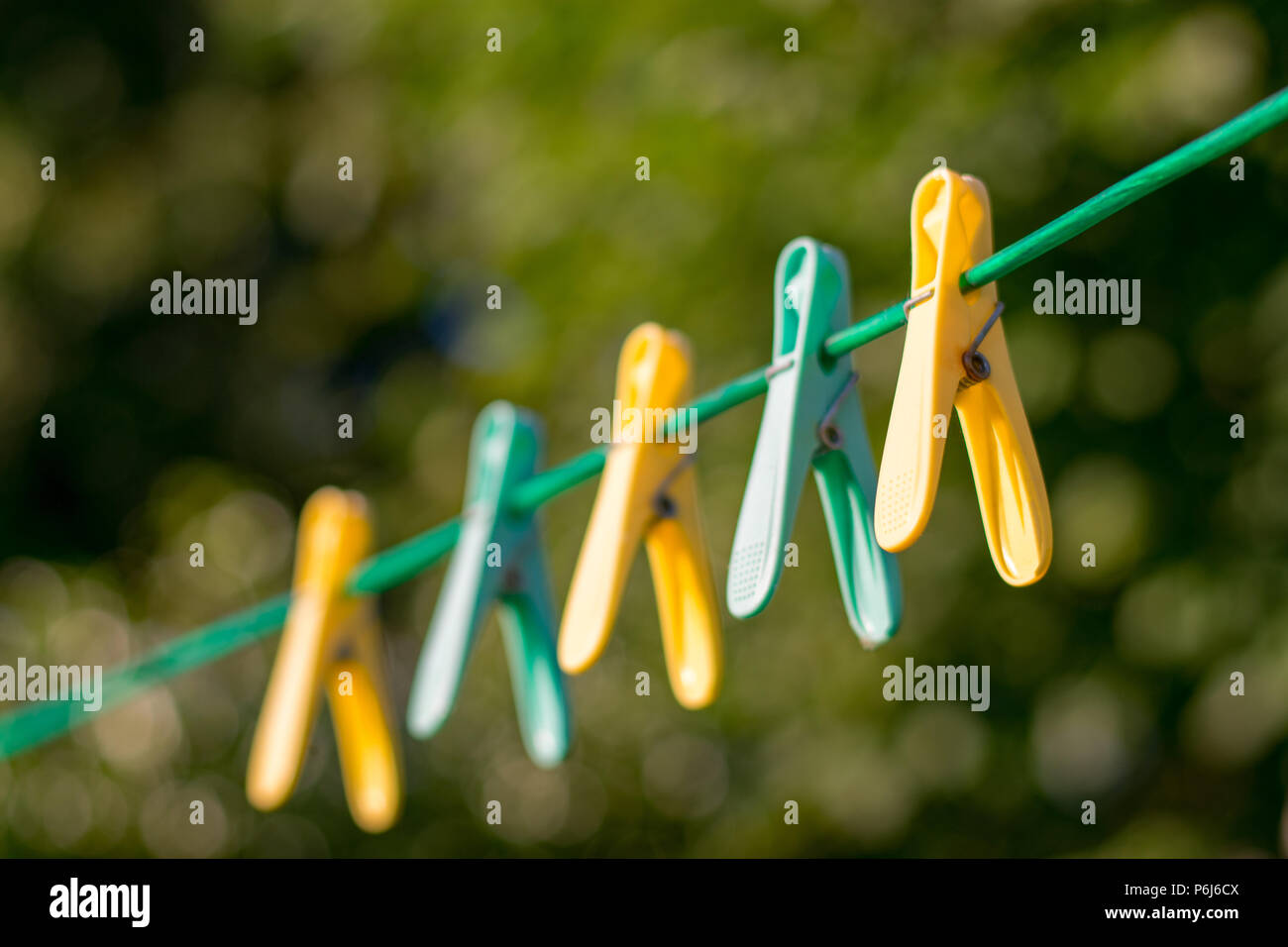 Pegs on a clothesline Stock Photo Alamy