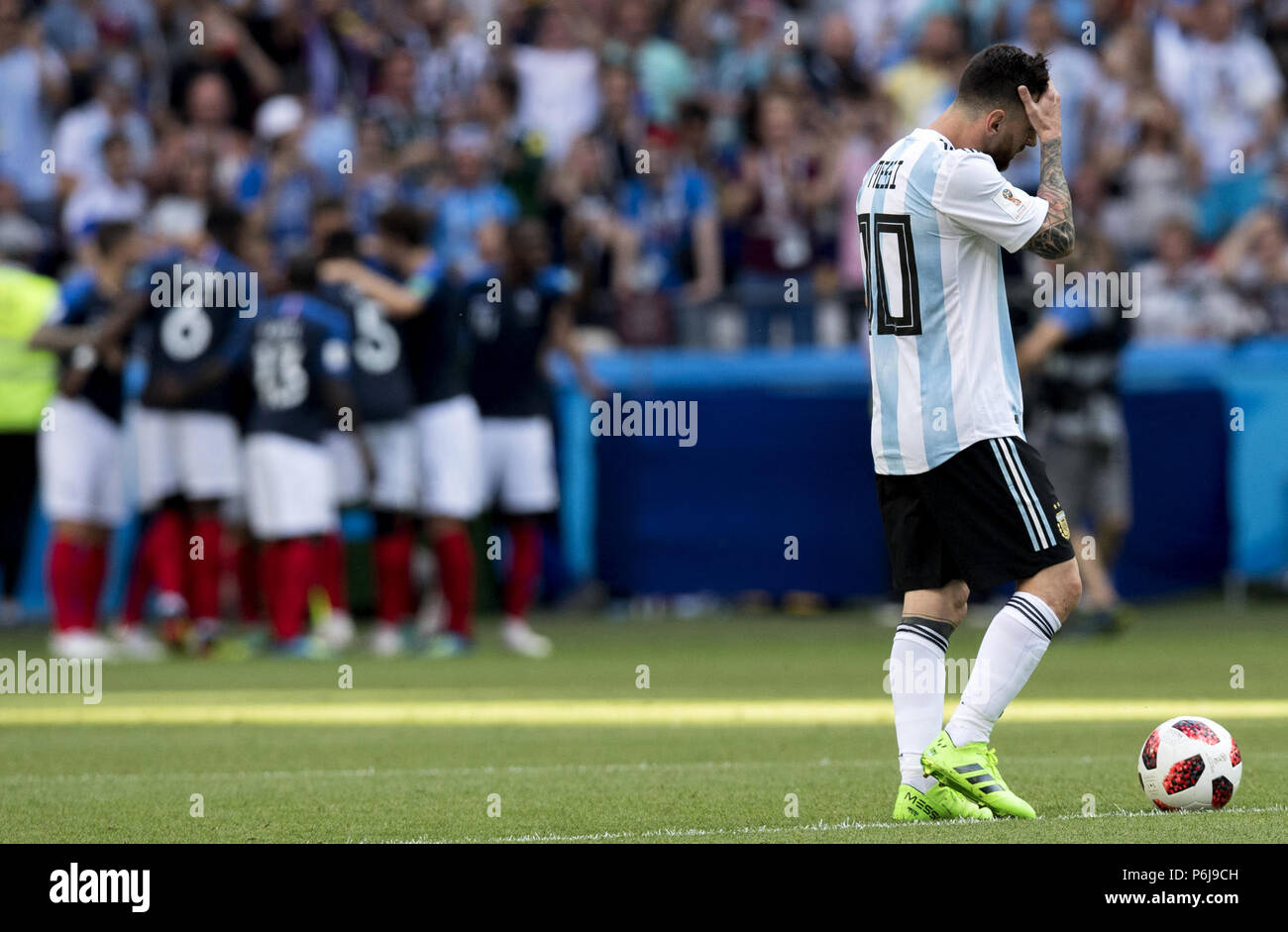 Kazan, Russia. 30th June, 2018. Football World Cup, France vs Argentina at the Kazan Arena. Lionel Messi (r) of Argentina reacts as France players celebrate a goal. Credit: Cezaro De Luca/dpa/Alamy Live News Stock Photo