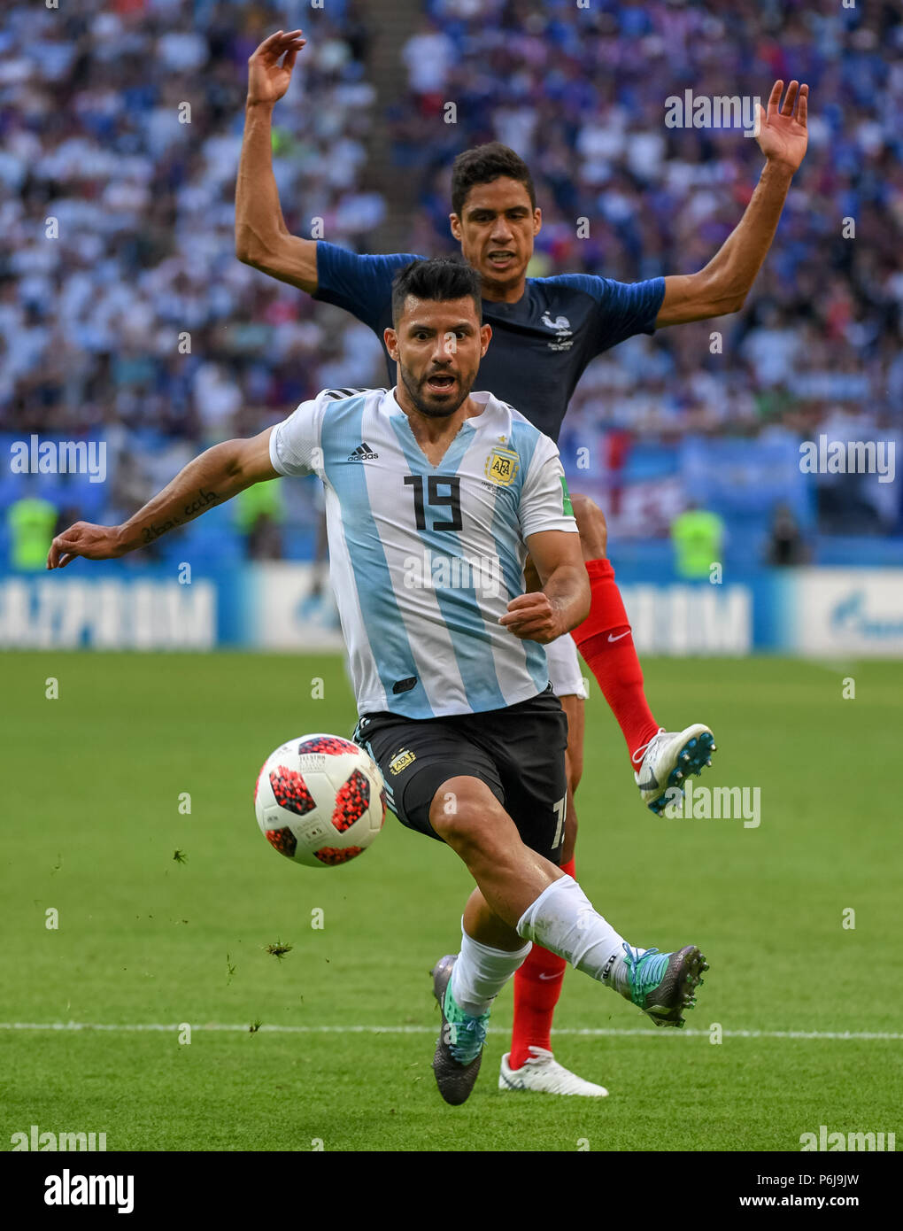 Kazan Arena, Kazan, Russia. 30th June, 2018. FIFA World Cup Football, Round of 16, France versus Argentina; Raphael Varane of France and Sergio Aguero of Argentina challenge for the ball Credit: Action Plus Sports/Alamy Live News Stock Photo