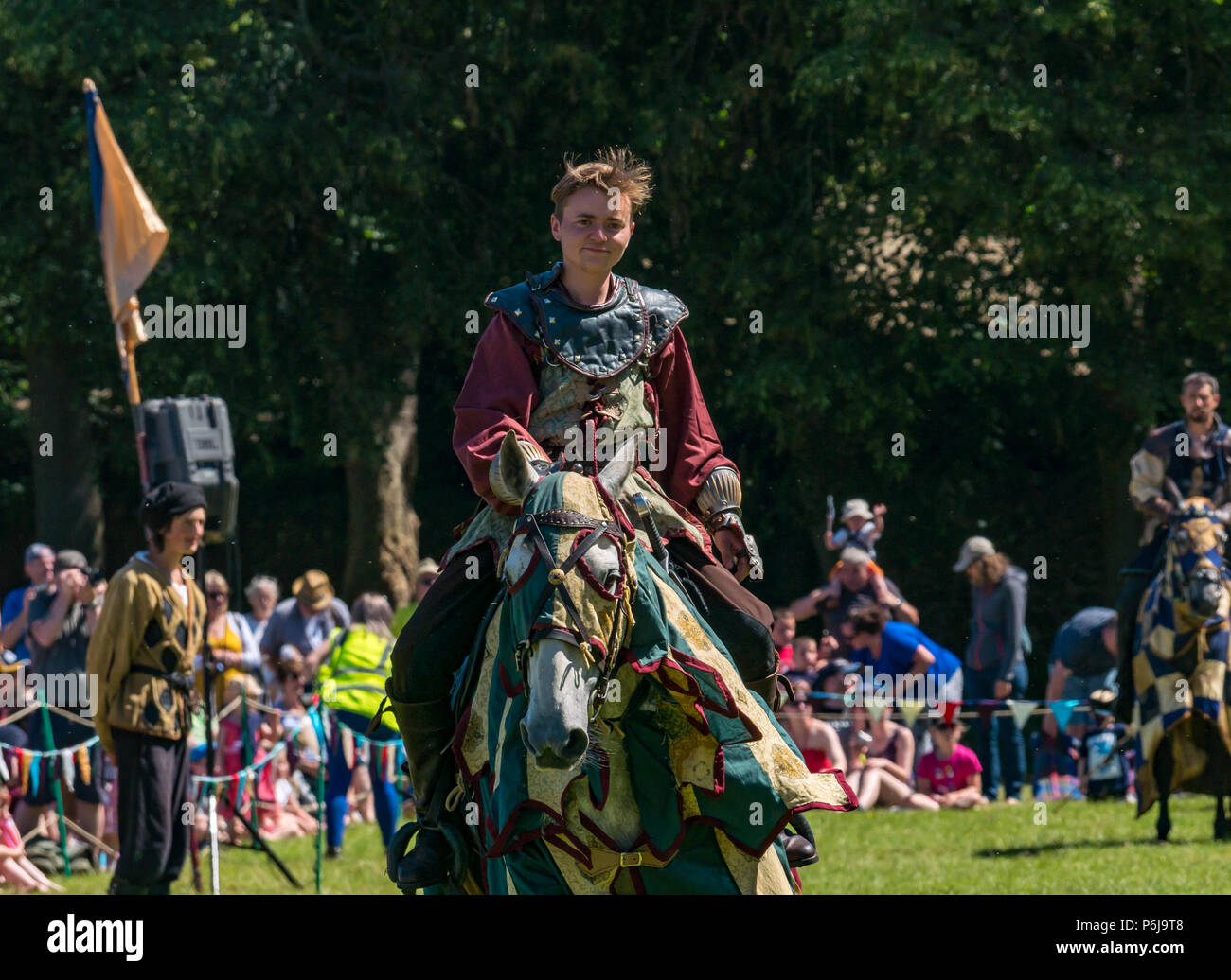 Jousting and Medieval Fair at Linlithgow Palace, Linlithgow, Scotland, United Kingdom, 30th June 2018. Historic Environment Scotland kick off their summer entertainment programme with a fabulous display of Medieval jousting in the grounds of the historic castle. The jousting is performed by Les Amis D'Onno equine stunt team based in the Borders. A knight rides a horse Stock Photo