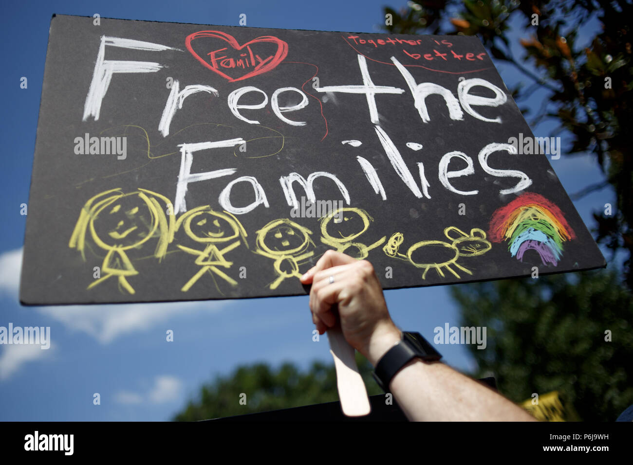 June 30, 2018 - Washington,District of Columbia, USA - Protestors gather in Lafayette Park, across from the White House, for the Families Belong Together rally. (Credit Image: © Michael Candelori via ZUMA Wire) Stock Photo