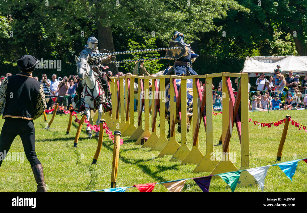 Jousting and Medieval Fair at Linlithgow Palace, Linlithgow, Scotland, United Kingdom, 30th June 2018. Historic Environment Scotland kick off their summer entertainment programme with a fabulous display of Medieval jousting in the grounds of the historic castle. The family fun day includes jousting by Les Amis D'Onno equine stunt team. Knights joust with lances Stock Photo