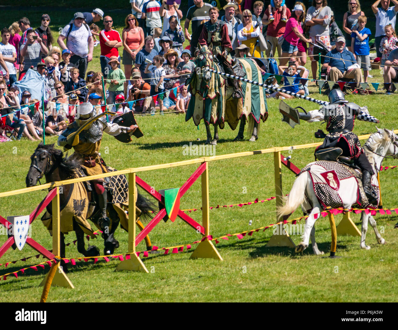 Jousting and Medieval Fair at Linlithgow Palace, Linlithgow, Scotland, United Kingdom, 30th June 2018. Historic Environment Scotland kick off their summer entertainment programme with a fabulous display of Medieval jousting in the grounds of the historic castle. The family fun day includes jousting performed by Les Amis D'Onno equine stunt team. Knight joust with lances Stock Photo