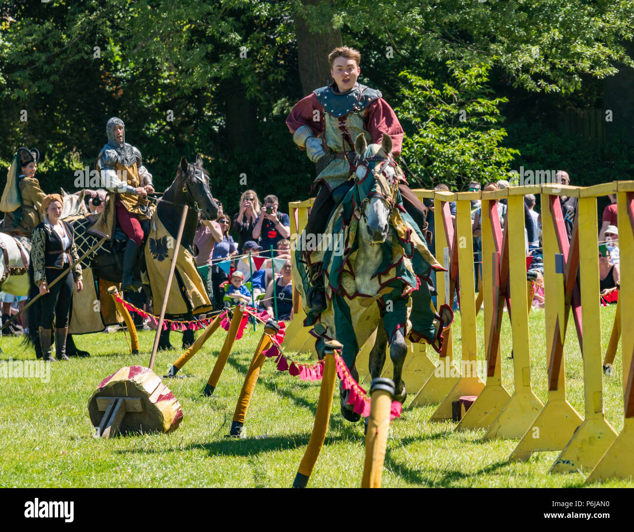 Jousting and Medieval Fair at Linlithgow Palace, Linlithgow, Scotland, United Kingdom, 30th June 2018. Historic Environment Scotland kick off their summer entertainment programme with a fabulous display of Medieval jousting in the grounds of the historic castle. The jousting is performed by Les Amis D'Onno equine stunt team based in the Borders. A knight rides a horse Stock Photo