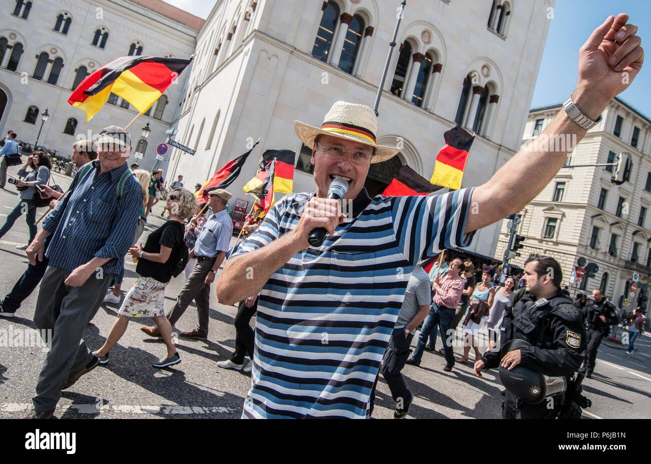 Munich, Bavaria, Germany. 30th June, 2018. Michael Sturzenberger (StÃ¼rzenberger). Pegida Dresden, one of two Pegida factions fighting for Munich, took to the streets on Saturday afternoon to call for Chancellor Merkel to step down. The chants of ''Merkel muss weg'' translate to ''Merkel must go''. Numerous right-extremists and neo-nazis were in attendance and the group was led by renowned islamophobe Michael Stuerzenberger (StÃ¼rzenberger) Credit: Sachelle Babbar/ZUMA Wire/Alamy Live News Stock Photo