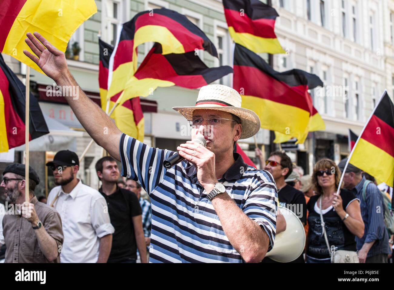 Munich, Bavaria, Germany. 30th June, 2018. Michael Sturzenberger (StÃ¼rzenberger). Pegida Dresden, one of two Pegida factions fighting for Munich, took to the streets on Saturday afternoon to call for Chancellor Merkel to step down. The chants of ''Merkel muss weg'' translate to ''Merkel must go''. Numerous right-extremists and neo-nazis were in attendance and the group was led by renowned islamophobe Michael Stuerzenberger (StÃ¼rzenberger) Credit: Sachelle Babbar/ZUMA Wire/Alamy Live News Stock Photo