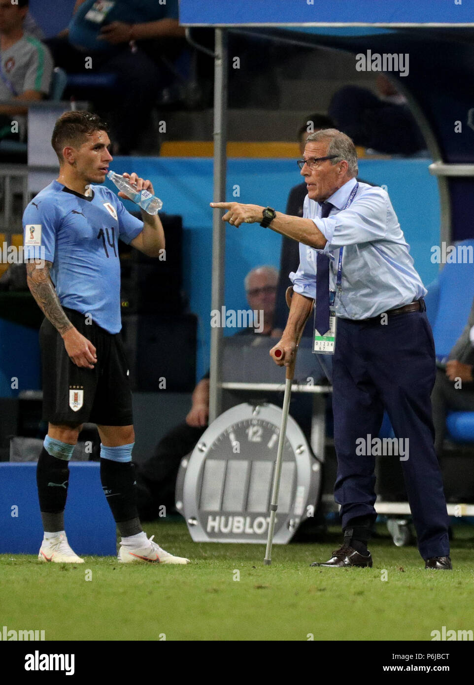 Sochi, Russia. 30th June, 2018. Football World Cup, Uruguay vs Portugal at the Fisht Stadium. Lucas Torreira of Uruguay talking to Uruguay coach Oscar Tabarez (r). Credit: Christian Charisius/dpa/Alamy Live News Stock Photo