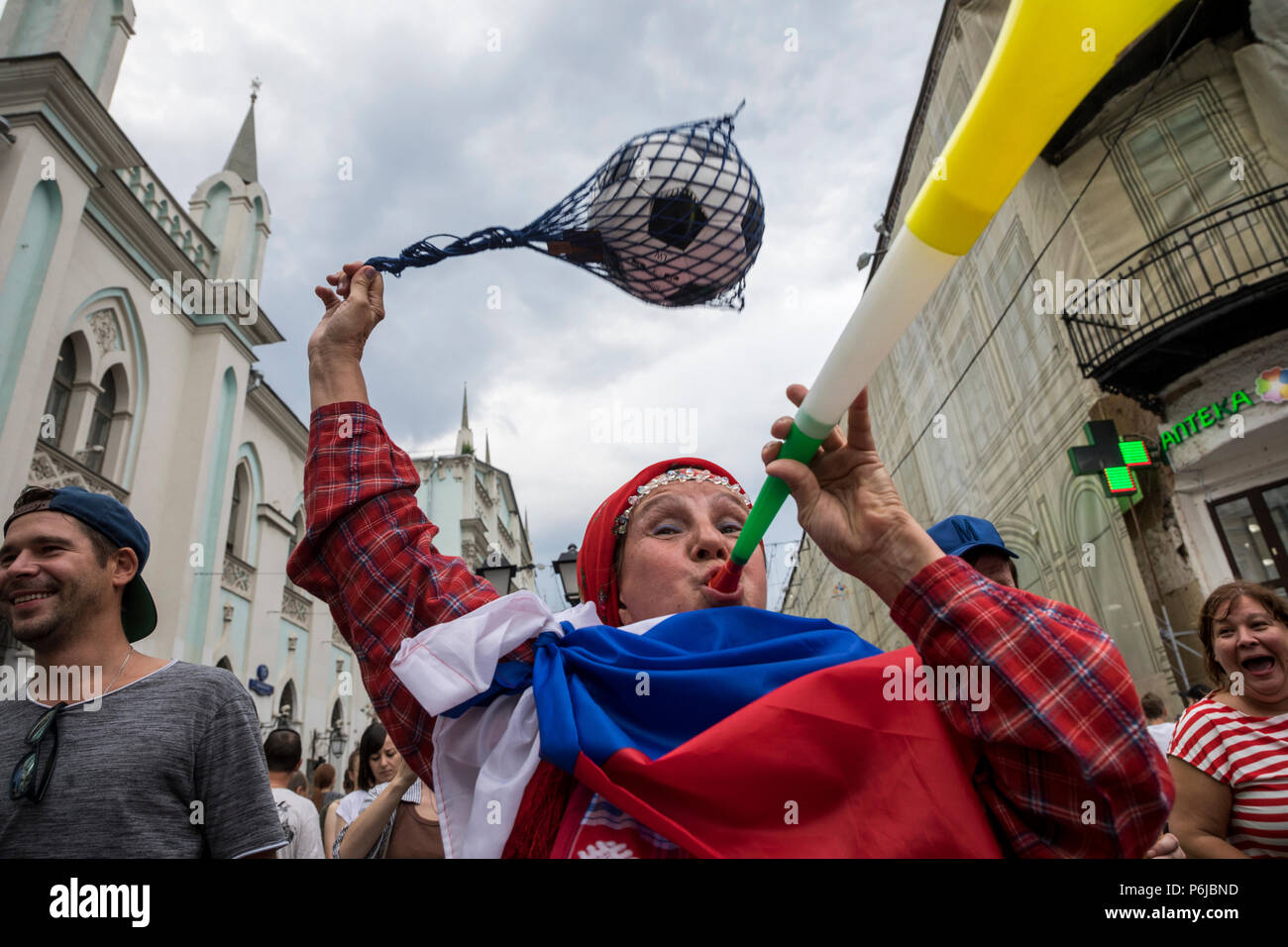 Moscow, Russia. 30th June, 2018. Russian babushkas cheering for Russian football team on Nikolskaya street in central Moscow during 2018 FIFA World Cup in Russia Credit: Nikolay Vinokurov/Alamy Live News Stock Photo