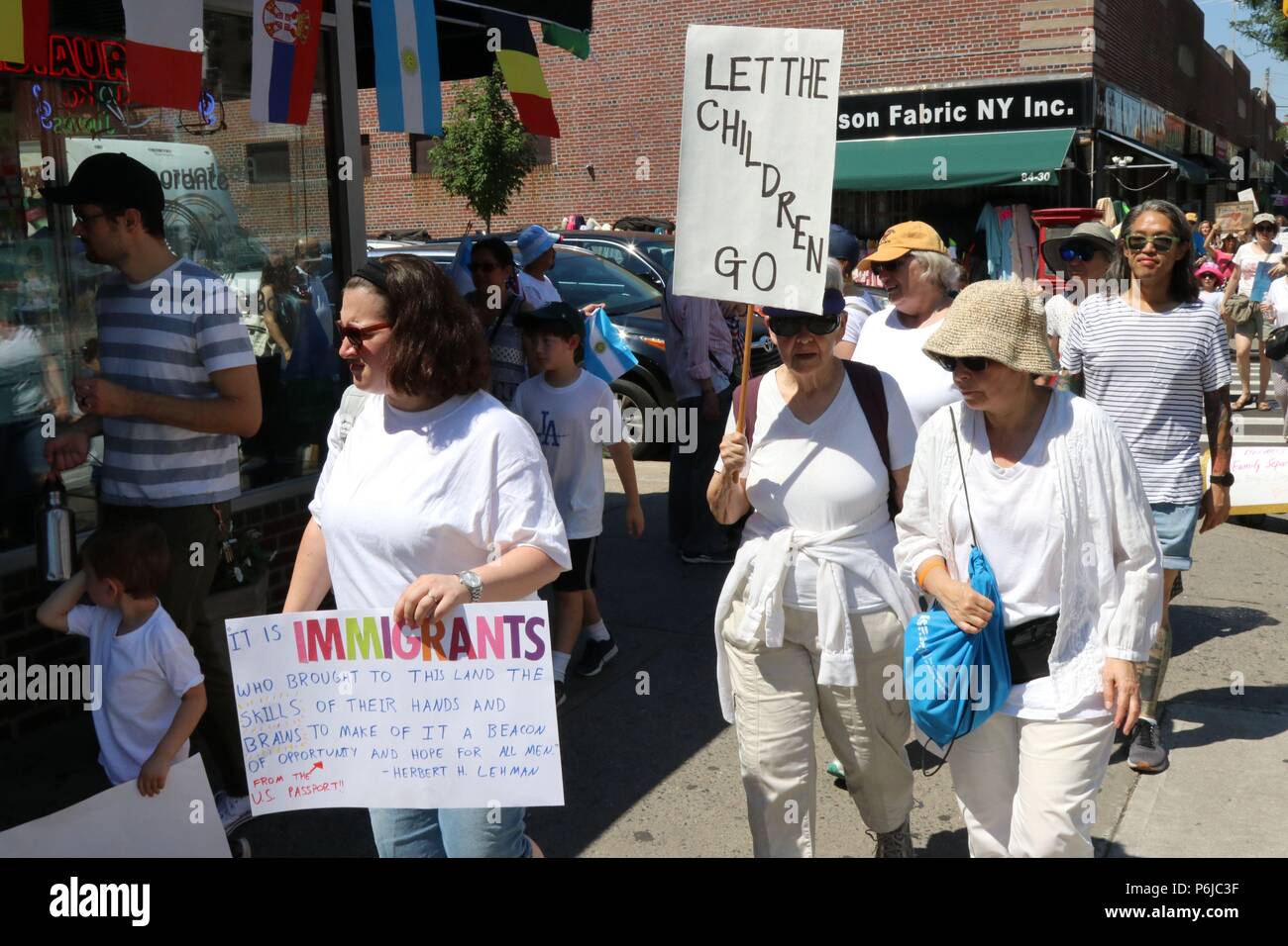 New York City, New York, USA. 30th June, 2018. The End Family Separation NYC Rally and March is one of several similar #FamiliesBelongTogether protest events taking place across the U.S. this weekend, 30th. June, 2018. This Queens, New York march and rally, took place in the most ethnically diverse neighborhood of the city in Jackson Heights and drew hundreds of passionate activist and protesters. Credit: G. Ronald Lopez/ZUMA Wire/Alamy Live News Stock Photo