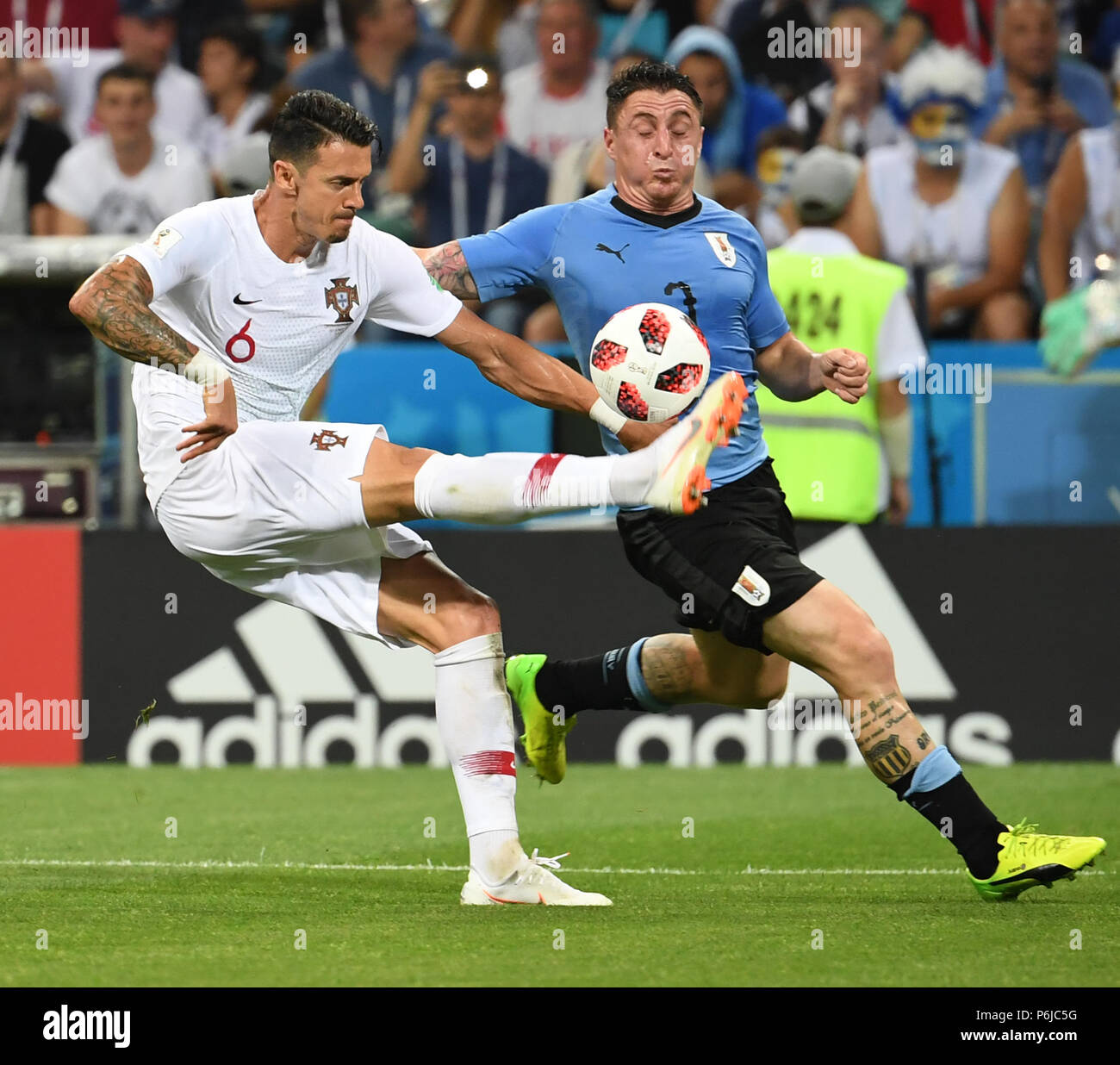 Sochi, Russia. 30th June, 2018. Jose Fonte (L) of Portugal vies with Cristian Rodriguez of Uruguay during the 2018 FIFA World Cup round of 16 match between Uruguay and Portugal in Sochi, Russia, on June 30, 2018. Uruguay won 2-1 and advanced to the quarter-final. Credit: Chen Cheng/Xinhua/Alamy Live News Stock Photo