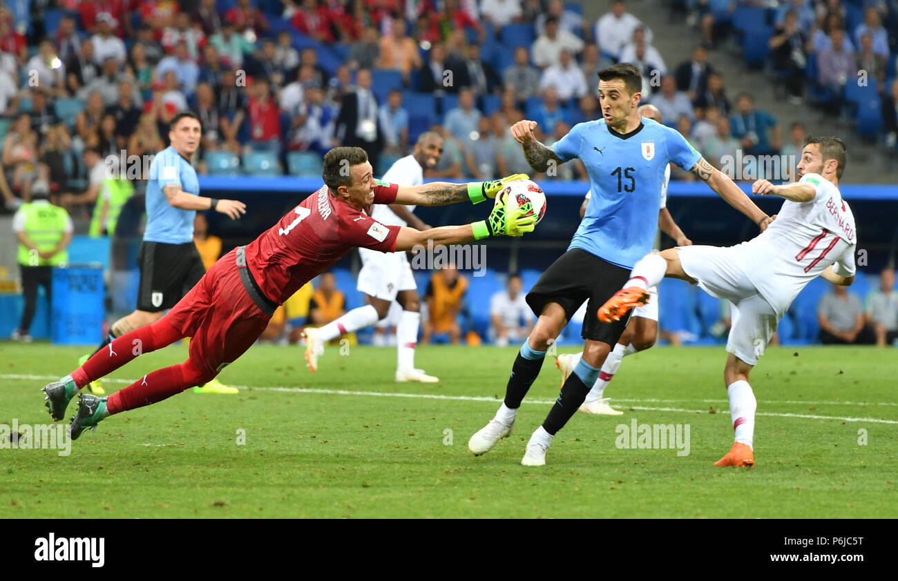 Sochi, Russia. 30th June, 2018. Goalkeeper Fernando Muslera (L front) of Uruguay saves the ball during the 2018 FIFA World Cup round of 16 match between Uruguay and Portugal in Sochi, Russia, on June 30, 2018. Uruguay won 2-1 and advanced to the quarter-final. Credit: Liu Dawei/Xinhua/Alamy Live News Stock Photo