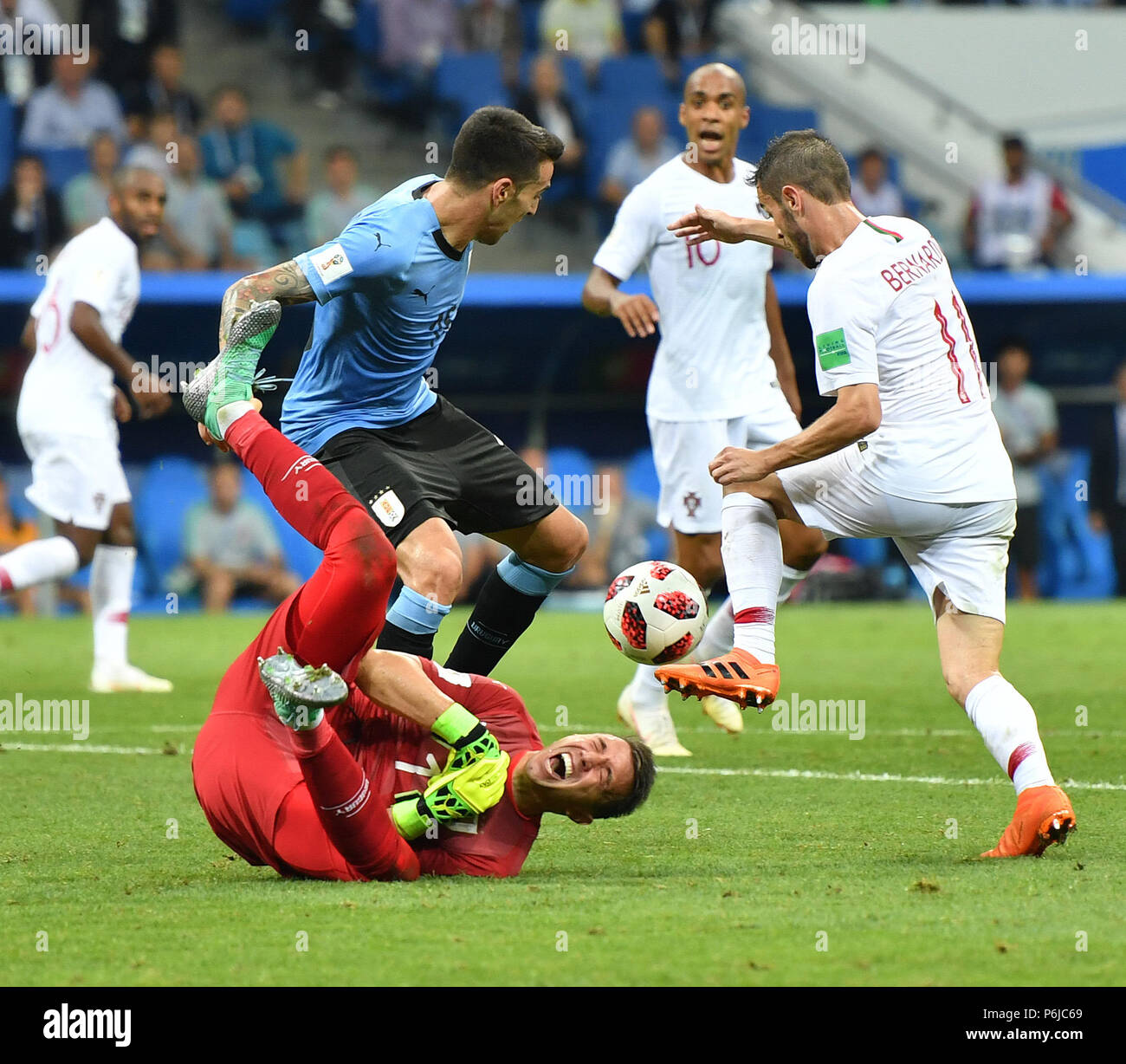 Sochi, Russia. 30th June, 2018. Goalkeeper Fernando Muslera (bottom) of Uruguay competes during the 2018 FIFA World Cup round of 16 match between Uruguay and Portugal in Sochi, Russia, on June 30, 2018. Uruguay won 2-1 and advanced to the quarter-final. Credit: Liu Dawei/Xinhua/Alamy Live News Stock Photo