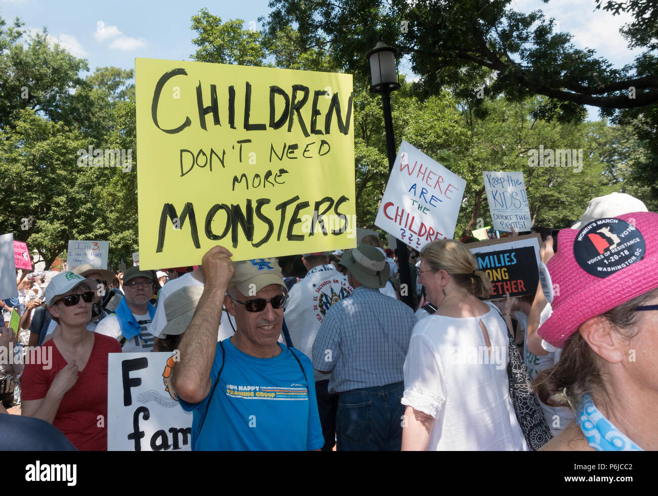 Washington, DC, USA.  30th June, 2018.  Some of the tens of thousands of participants in the Families Belong Together at rally in Lafayette Park in front of the White House, protesting the Trump administration’s vilification of immigrants, and zero-tolerance policy of automatically criminalizing undocumented immigrants, including those seeking asylum, which has included removing children from their parents at the Mexican border. A march to the Justice Department followed the rally. Credit: Bob Korn/Alamy Live News Stock Photo