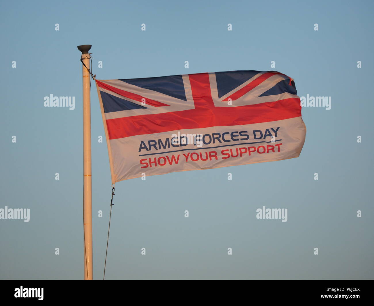 Sheerness, Kent, UK. 30th June, 2018. UK Weather: the Armed Forces Day flag at sunset in Sheerness, Kent. Credit: James Bell/Alamy Live News Stock Photo
