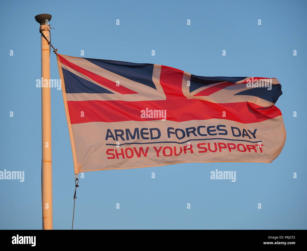 Sheerness, Kent, UK. 30th June, 2018. UK Weather: the Armed Forces Day flag at sunset in Sheerness, Kent. Credit: James Bell/Alamy Live News Stock Photo