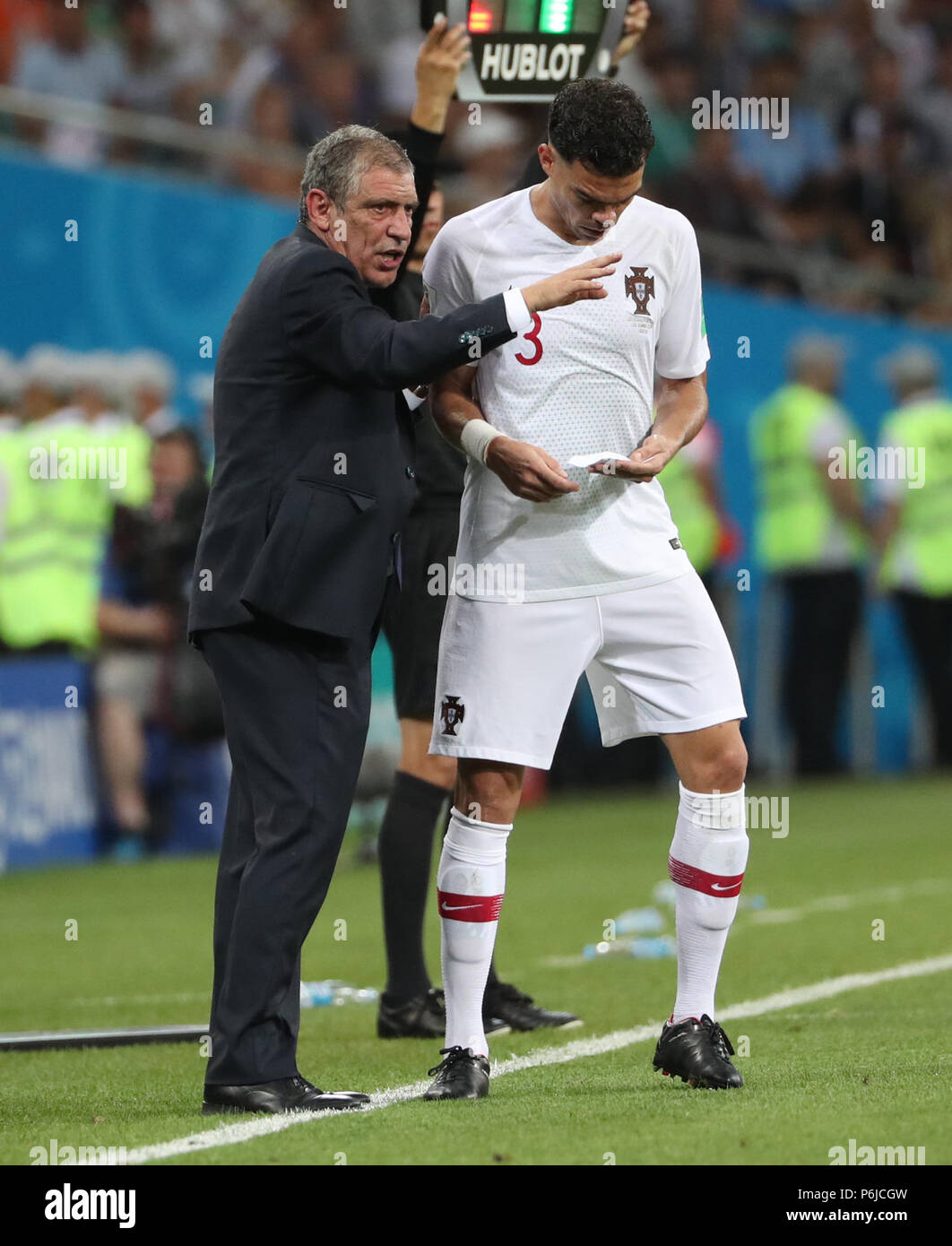 Sochi, Russia. 30th June, 2018. Head coach Fernando Santos (L) of Portugal gives instructions to Pepe during the 2018 FIFA World Cup round of 16 match between Uruguay and Portugal in Sochi, Russia, June 30, 2018. Uruguay won 2-1 and advanced to the quarter-final. Credit: Ye Pingfan/Xinhua/Alamy Live News Stock Photo