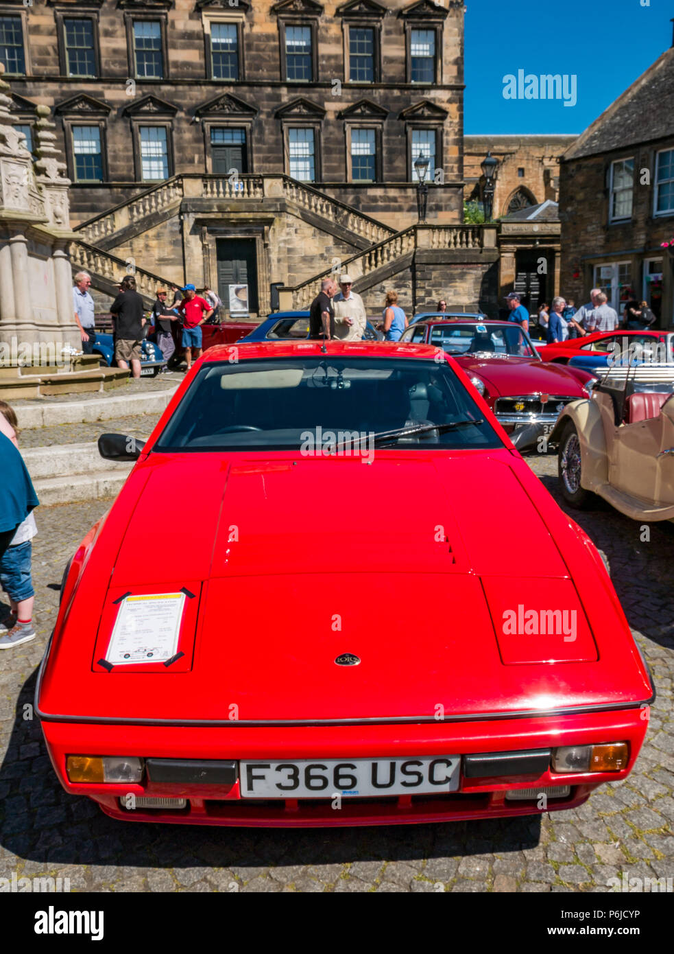 The Cross, Kirkgate, Linlithgow, West Lothian, Scotland, United Kingdom, 30th June 2018. Enthusiasts display vintage cars  at a rally on a sunny Summer day. A red 1988 Lotus Excel Stock Photo