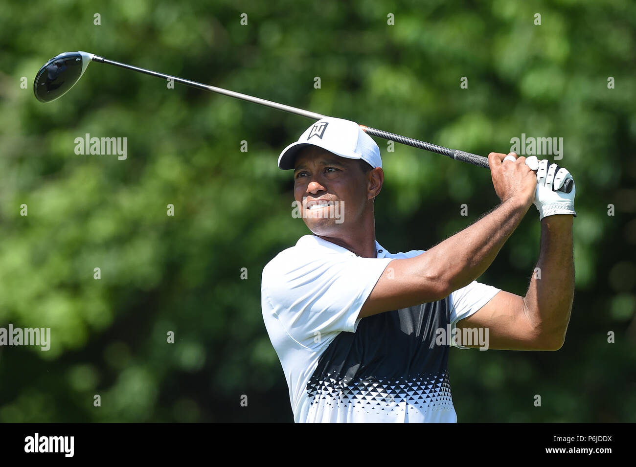 JUNE 30, 2018 - Tiger Woods (USA) tees off at the fifteenth hole during the third round at the 2018 Quicken Loans National at the Tournament Players Club in Potomac MD. Stock Photo