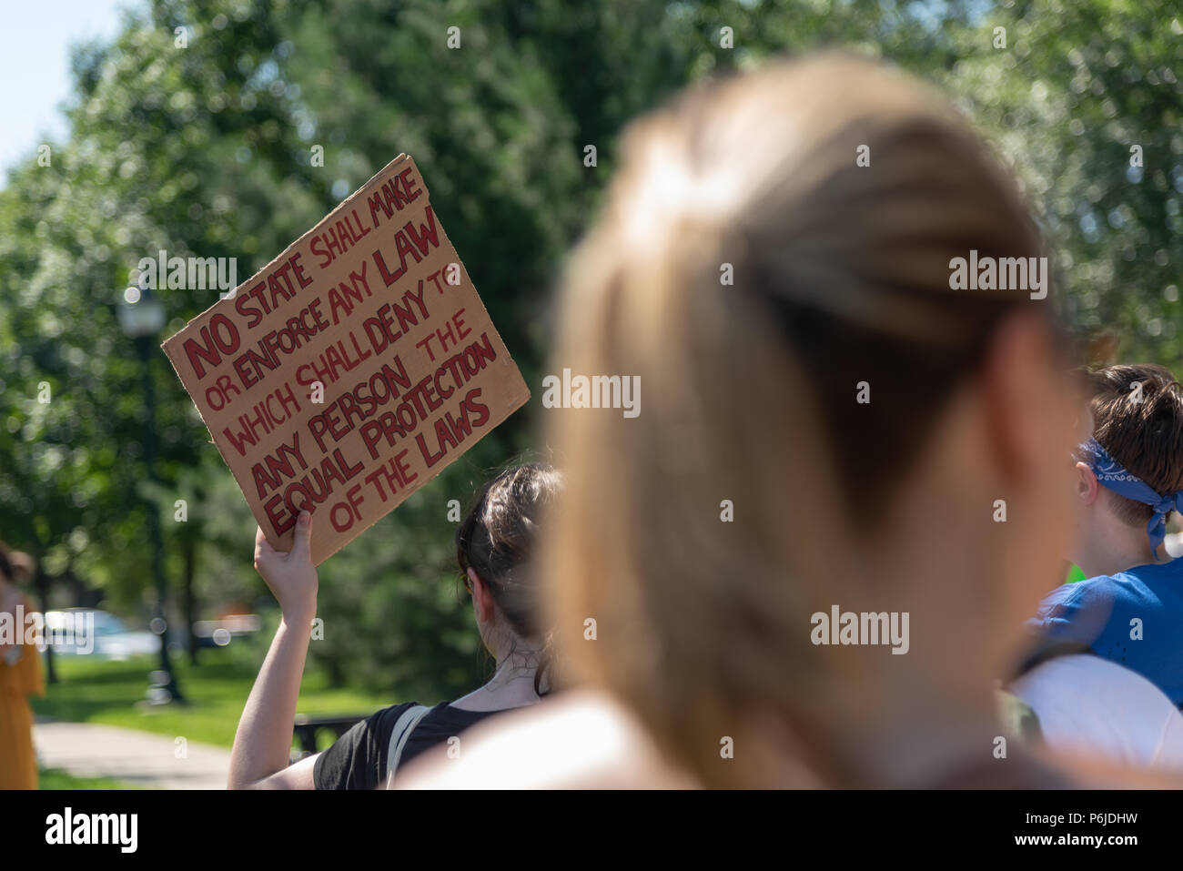 Iowa City, Iowa. 30th June 2018. Protest against ICE Family Separation policy of the government. People gathered at a downtown city park after a march that started from the Old Capitol Building. Madhu V. Singh/Alamy Live News Stock Photo