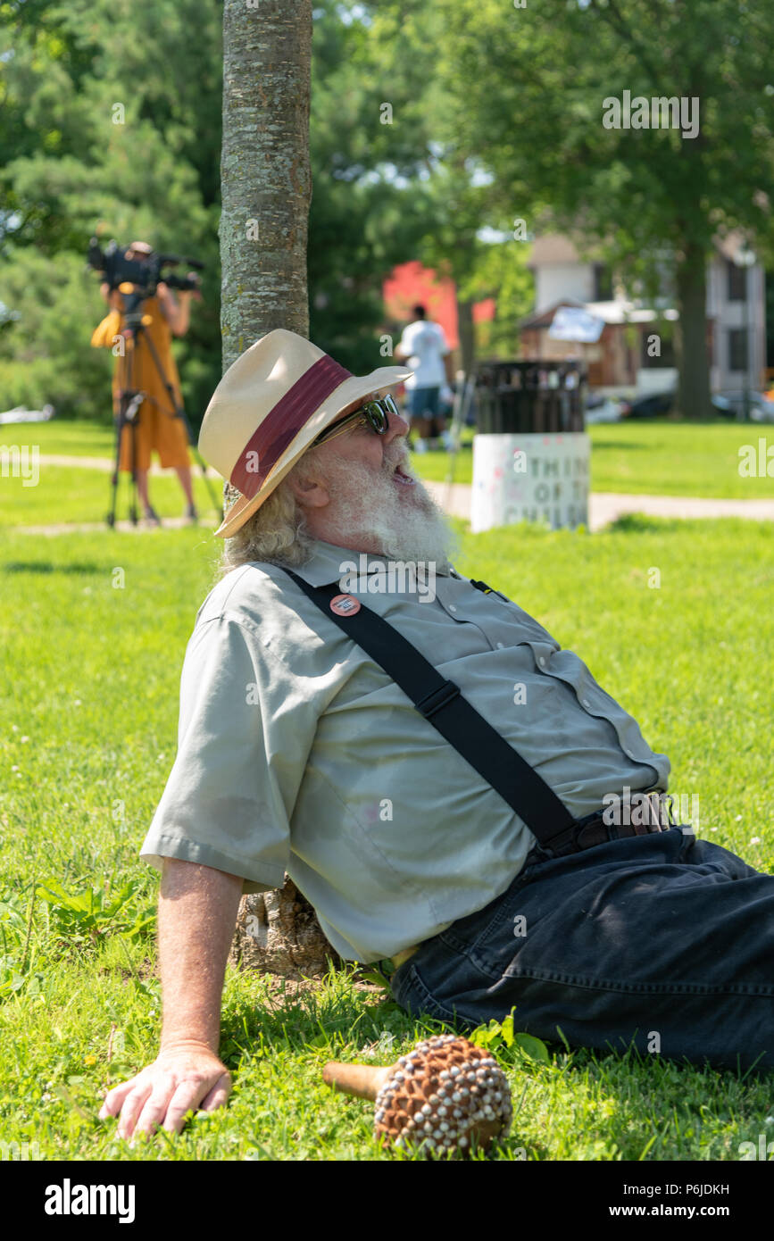 Iowa City, Iowa. 30th June 2018. Protest against ICE Family Separation policy of the government. People gathered at a downtown city park after a march that started from the Old Capitol Building. Madhu V. Singh/Alamy Live News Stock Photo