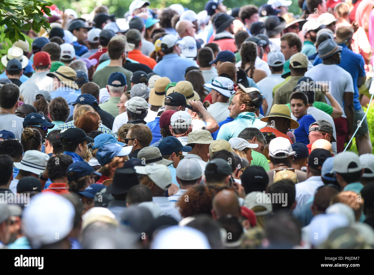 JUNE 30, 2018 - Huge galleries follow Tiger Woods (USA) to the thirteenth hole during the third round at the 2018 Quicken Loans National at the Tournament Players Club in Potomac MD. Stock Photo