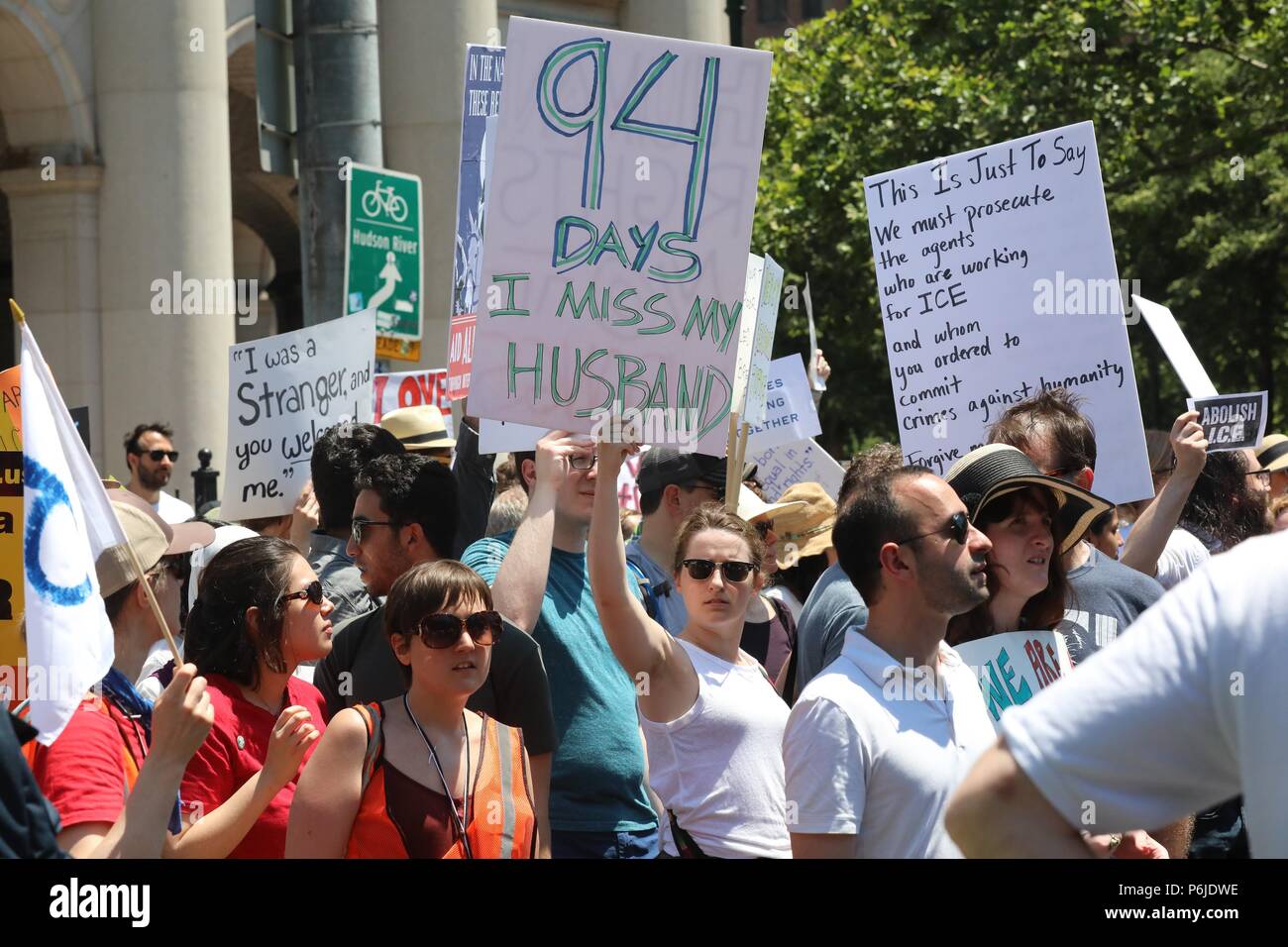 New York, USA. 30th June, 2018. People participate in the 'End Family Separation NYC' rally at downtown Manhattan in New York, the United States, on June 30, 2018. Tens of thousands of Americans marched and rallied across the United States to protest the Trump administration's 'zero tolerance' immigration policy resulting in over 2,000 children separated from their families who crossed the border illegally. Credit: Zhou Sa'ang/Xinhua/Alamy Live News Stock Photo