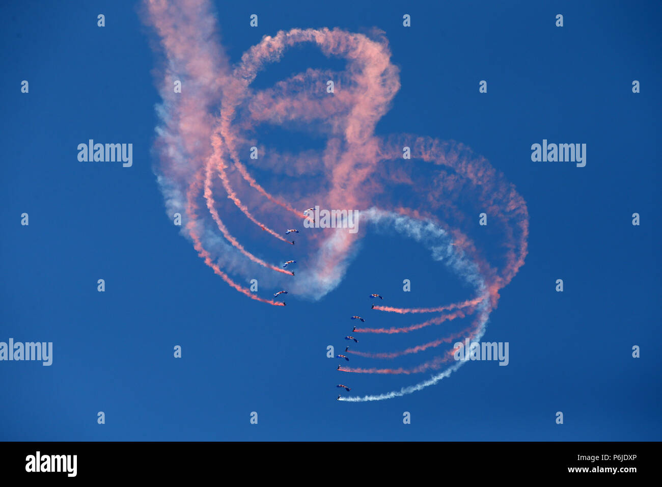 Swansea, UK. 30th Jun, 2018. UK Weather. the Red Devils parachute display team perform at The Wales Airshow 2018 in Swansea Bay, South Wales on Saturday 30th June 2018.  pic by Andrew Orchard/Alamy Live News Stock Photo