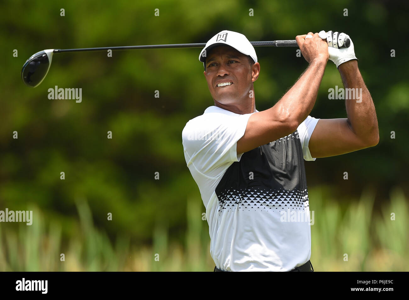 JUNE 30, 2018 - Tiger Woods (USA) tees off at hole number six during the third round at the 2018 Quicken Loans National at the Tournament Players Club in Potomac MD. Stock Photo