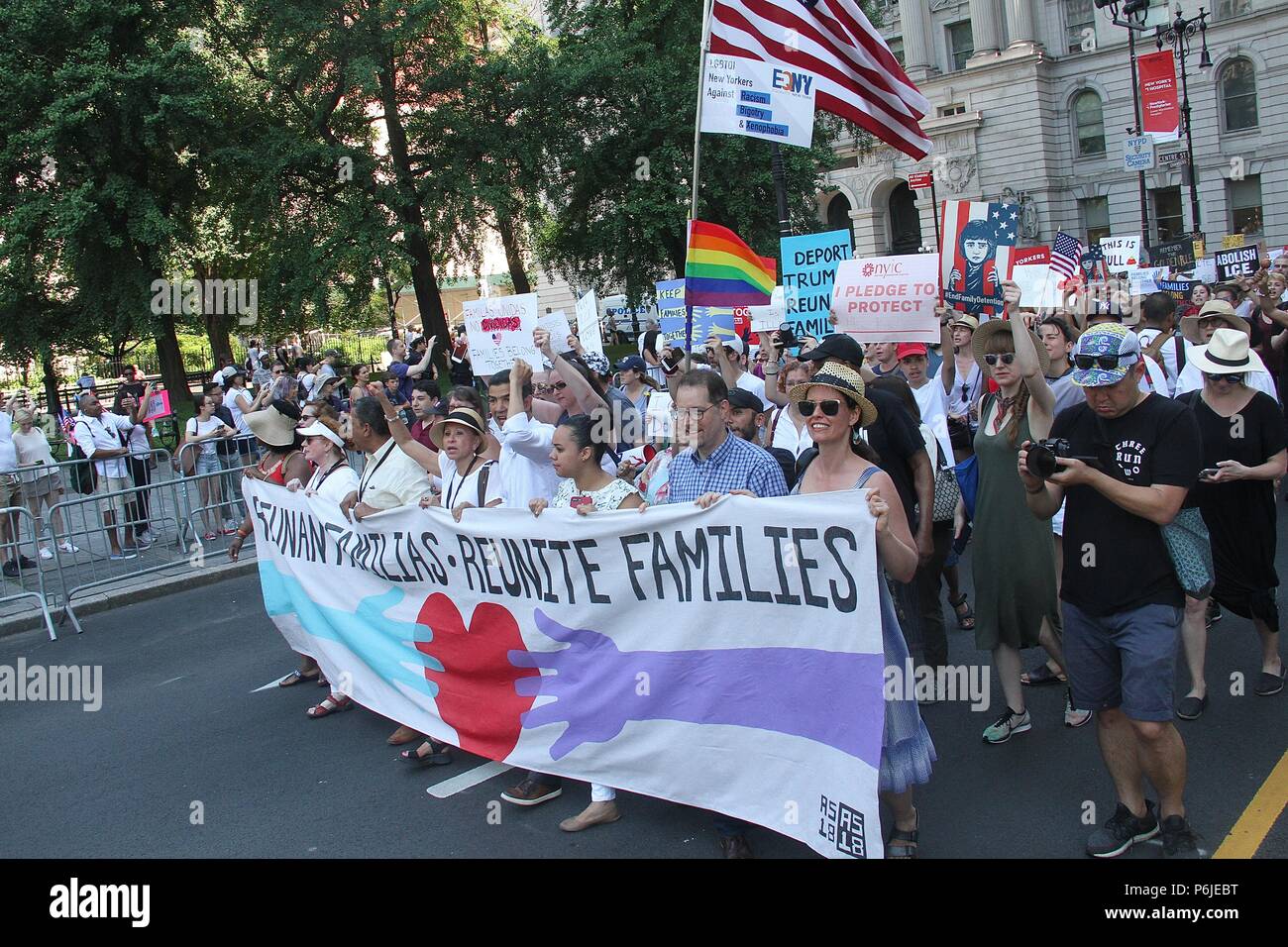 New York, NY, USA. 30th June, 2018. Participants in the 'End Family Separation NYC Rally and March in which protesters marched from Manhattan's Foley Square across the Brooklyn Bridge to Brooklyn's Cadman Plaza to protest President Donald Trump's immigration policy in New York, New York on June 30, 2018. Credit: Rainmaker Photo/Media Punch/Alamy Live News Stock Photo