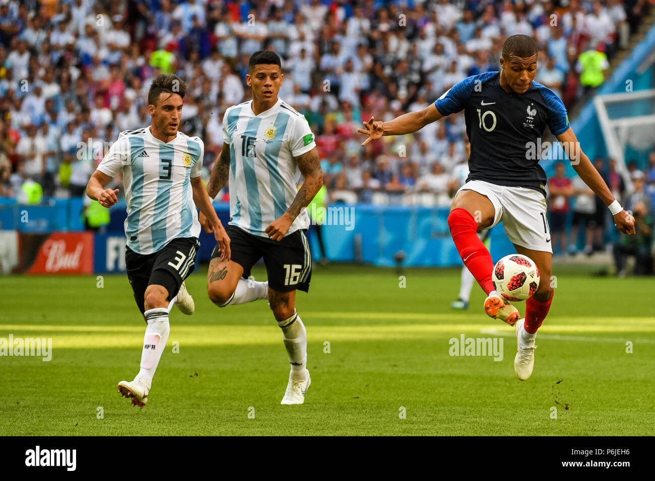 Kazan Arena, Kazan, Russia. 30th June, 2018. FIFA World Cup Football, Round of 16, France versus Argentina; Kylian Mbappe of France taking the ball down in front of Nicolas Tagliafico of Argentina and Marcos Rojo of Argentina Credit: Action Plus Sports/Alamy Live News Stock Photo
