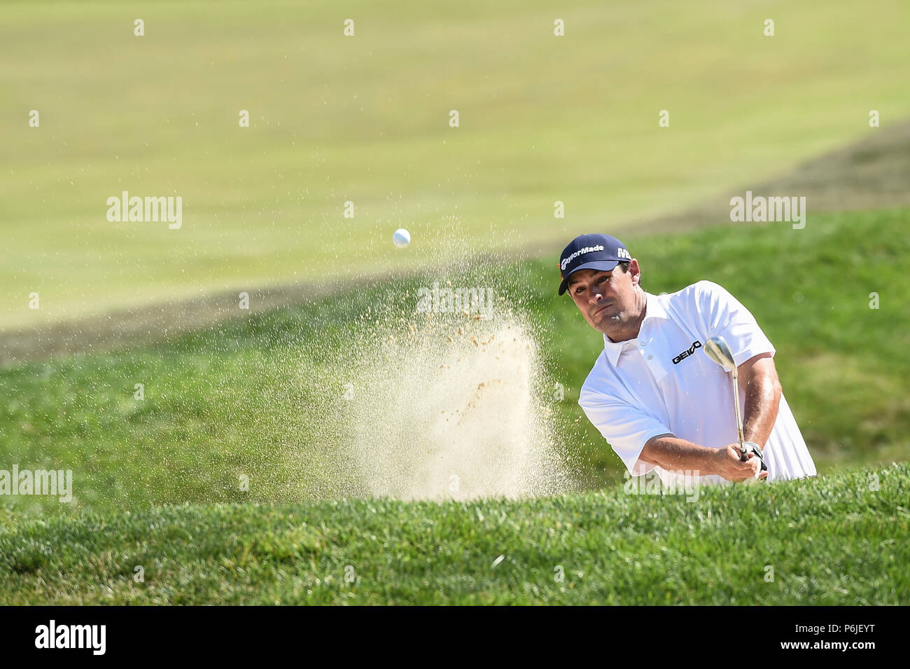 JUNE 30, 2018 - Johnson Wagner (USA) hits out of the green side bunker on hole fourteen during the third round at the 2018 Quicken Loans National at the Tournament Players Club in Potomac MD. Stock Photo
