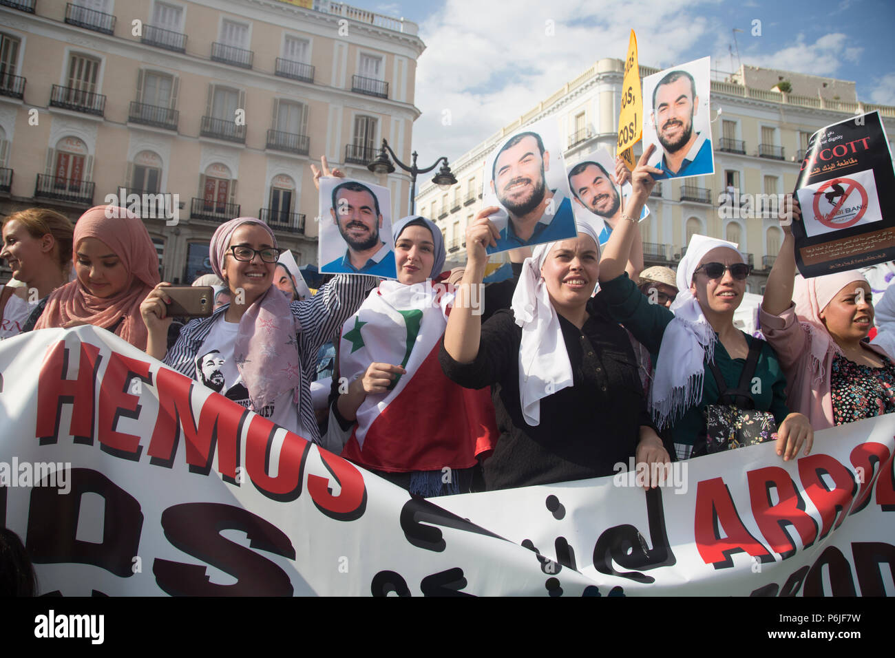 Anti Razia Riffat Group of Muslim women show the photo of Nasser Zefzafi, leader of the ...