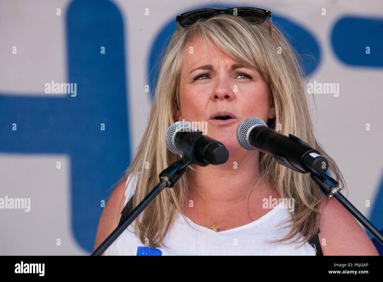 London, UK. 30th June 2018. Former Coronation Street actress Sally Lindsay addresses thousands of people, including many nurses, doctors and health workers, attending a rally and march to mark the 70th birthday of the National Health Service (NHS) and to demand an end to cuts to and privatisation of public services. The event was organised by the People's Assembly Against Austerity, Health Campaigns Together, the TUC and eleven other health trade unions. Credit: Mark Kerrison/Alamy Live News Stock Photo