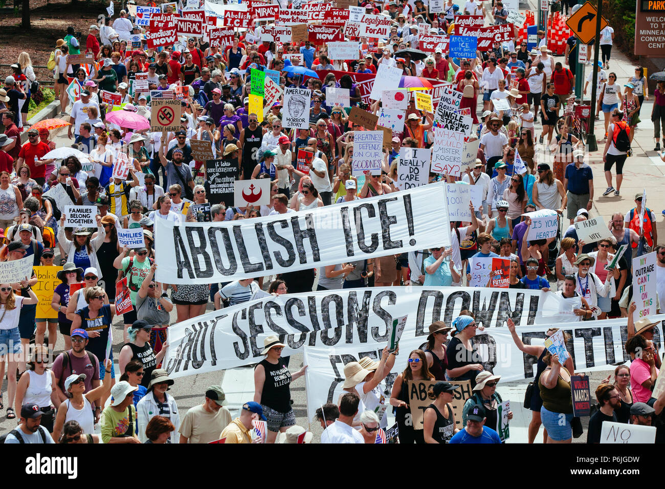 Minneapolis, USA. 30th Jun, 2018. Thousands met at the Minneapolis Convention Center to march in protest of President Donald Trump's separation of families immigration policy. Credit: Theresa Scarbrough/Alamy Live News Stock Photo