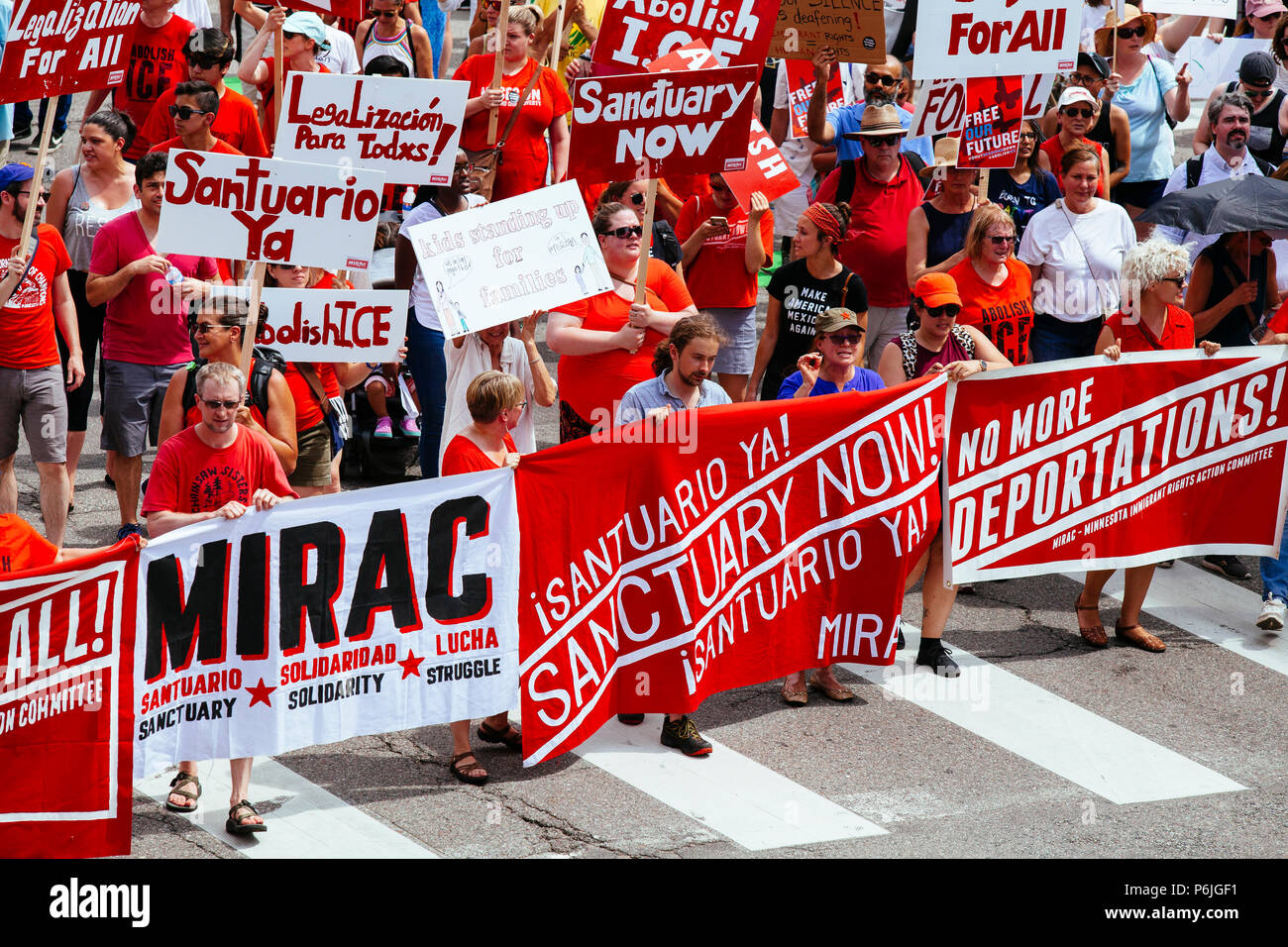 Minneapolis, USA. 30th Jun, 2018. Thousands met at the Minneapolis Convention Center to march in protest of President Donald Trump's separation of families immigration policy. Credit: Theresa Scarbrough/Alamy Live News Stock Photo