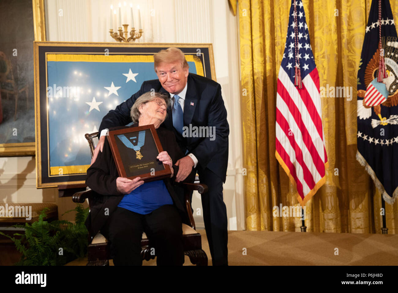WASHINGTON, DC - WEEK OF JUNE 24: President Donald J. Trump presents the Medal of Honor to Mrs. Pauline Conner, widow of the late U.S. Army 1st Lt. Garlin Murl Conner, on Tuesday, June 26, 2018, in the East Room of the White House.  People:  President Donald Trump Stock Photo