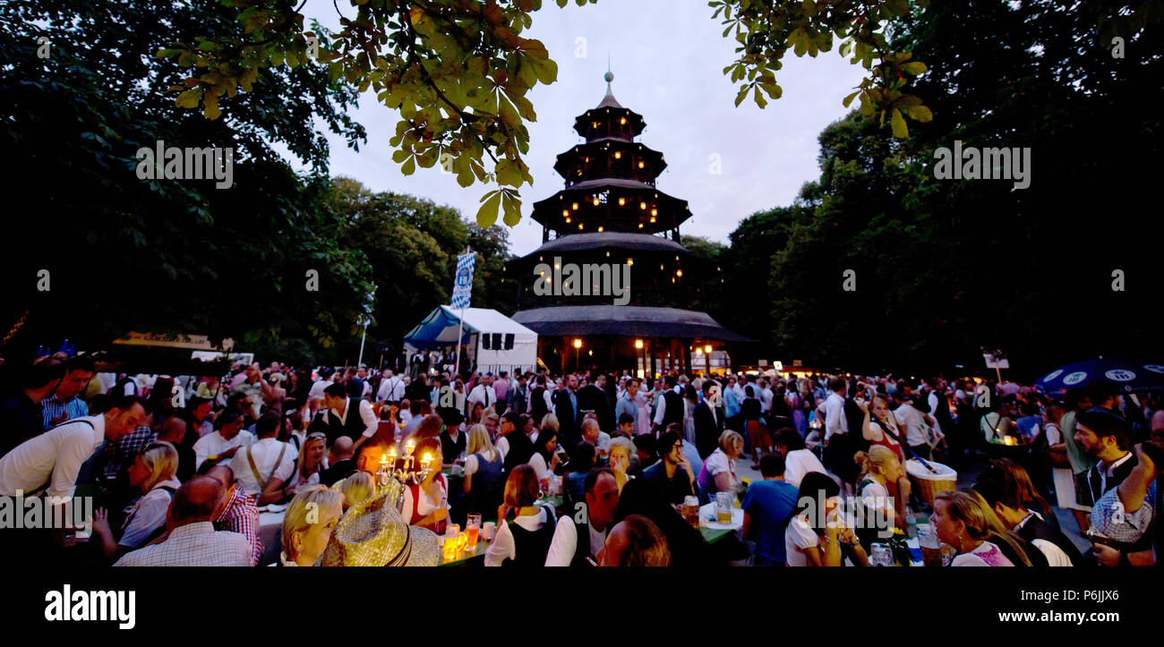 Munich, Germany. 20th July, 2014. Countless visitors of the traditional Kocherlball sitting by the beer tables at the Chinese Tower in the English garden. Once a year, the British magazine 'Monocle' compiles a ranking of the 25 'most liveable cities'. In 2018 the German metropolis Muenchen is once more among the top cities. Credit: Sven Hoppe/dpa/Alamy Live News Stock Photo