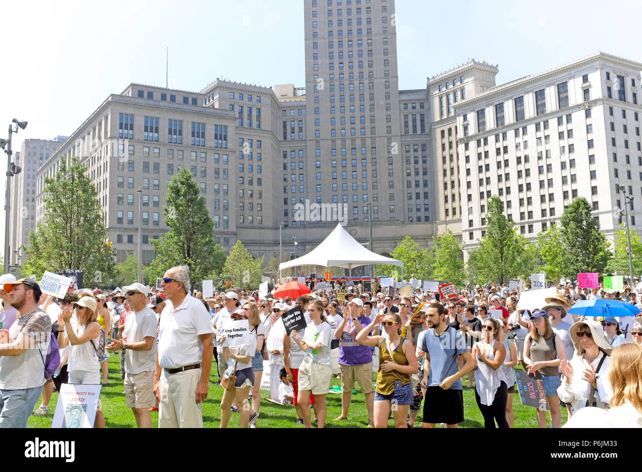 Cleveland, USA.  30th June, 2018.  Protesters gather in downtown Cleveland on Public Square to voice opposition to the Trump policies separating children from parents at the US border. . Credit: Mark Kanning/Alamy Live News Stock Photo