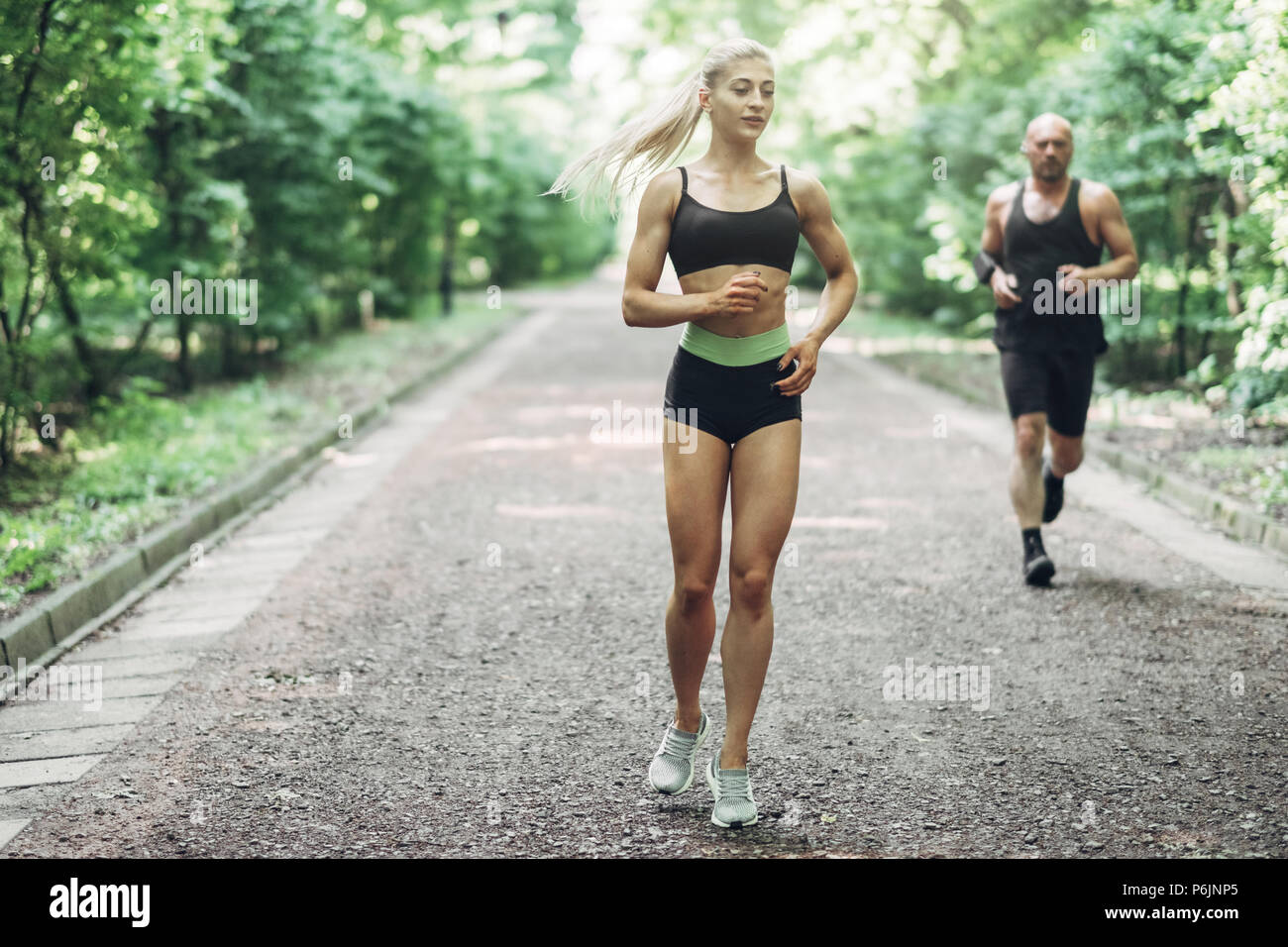Young Woman Running. Beautiful fit Girl. Fitness model outdoors. Weight Loss Stock Photo - Alamy